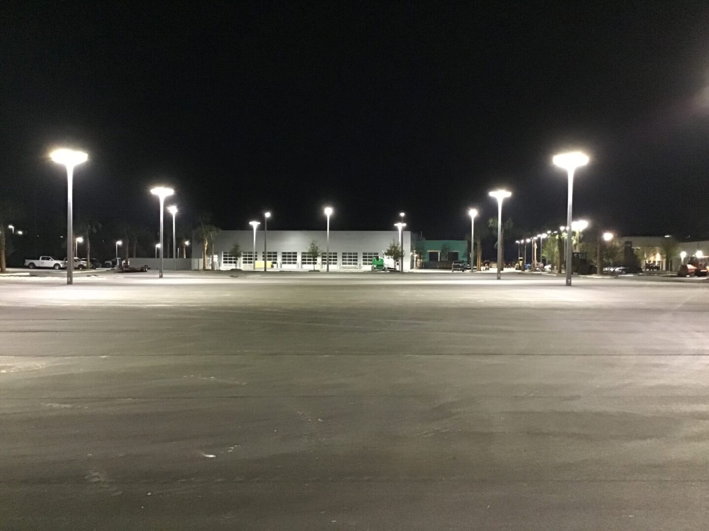 A parking lot with many lights on the top of it