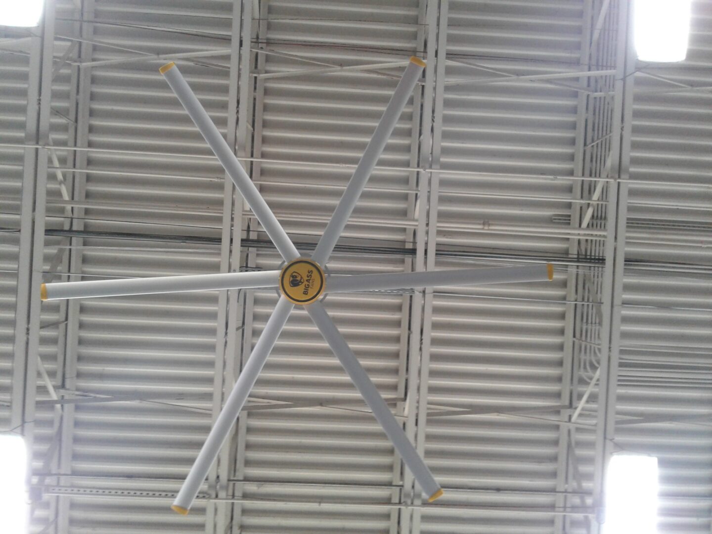 A large ceiling fan in an industrial building.